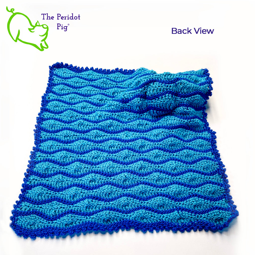 Cliff the Crab is featured on this cute security blanket! Some think he can be a bit terse but he's really the life of the party. Those eyes pop up and just seem to say, "Hellloooooo!" He's hanging out in the waves of a bright blue, Caribbean ocean.  He's made of 100% high, quality acrylic yarn for a really durable blanket. He's sewn onto the blanket which measures 17x18". Perfect for a beach house or an Under the Sea themed room! Back view shown.