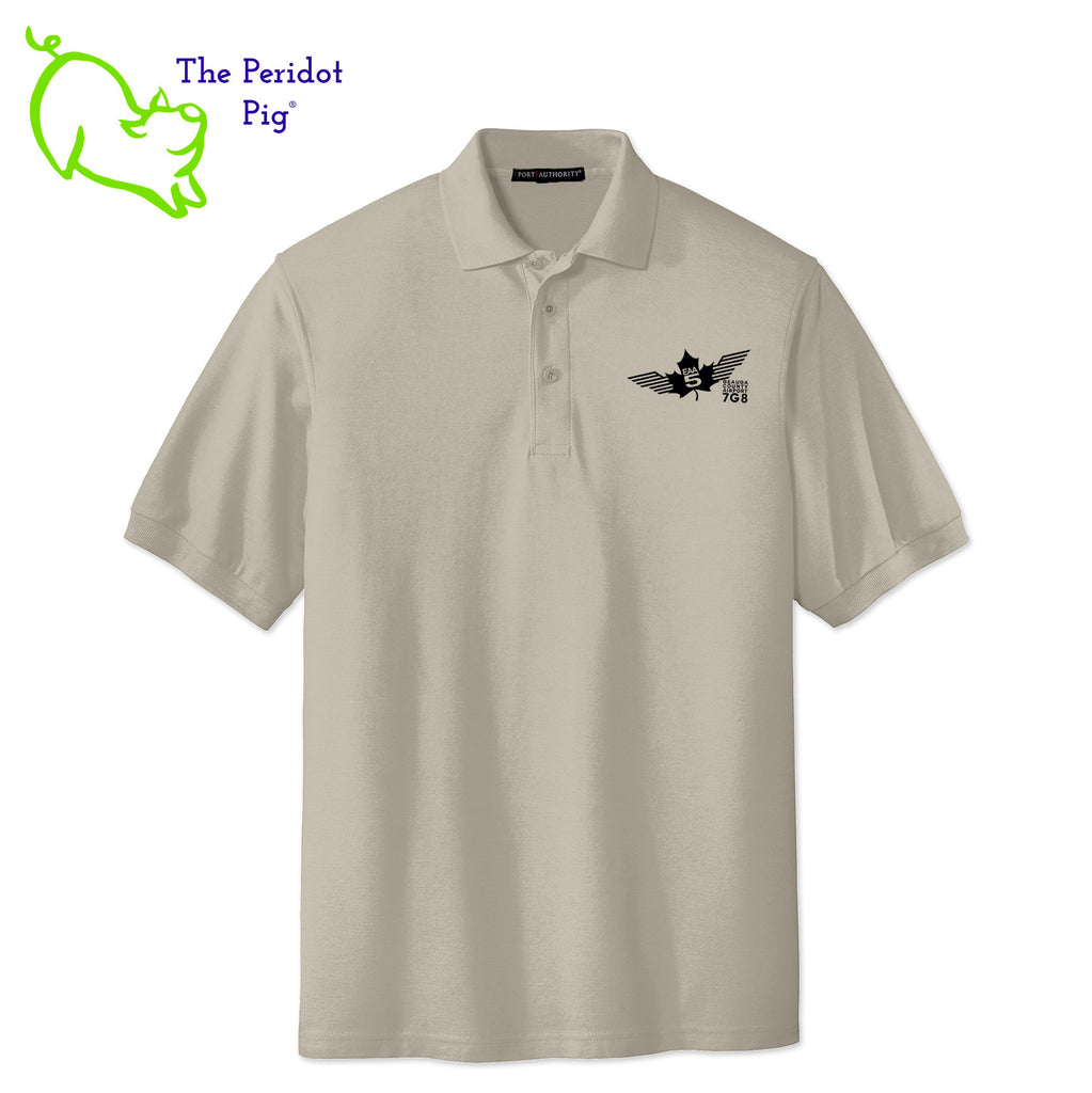 Renowned for its resilience, our incomparably comfortable classic polo is second to none. Expertly designed to resist wrinkles and shrinkage, this must-have polo delivers a luxuriously soft feel. Featuring the iconic EAA Chapter 5 logo on the left chest, you won't ever regret choosing this timeless piece. Front view shown in Stone-Black.