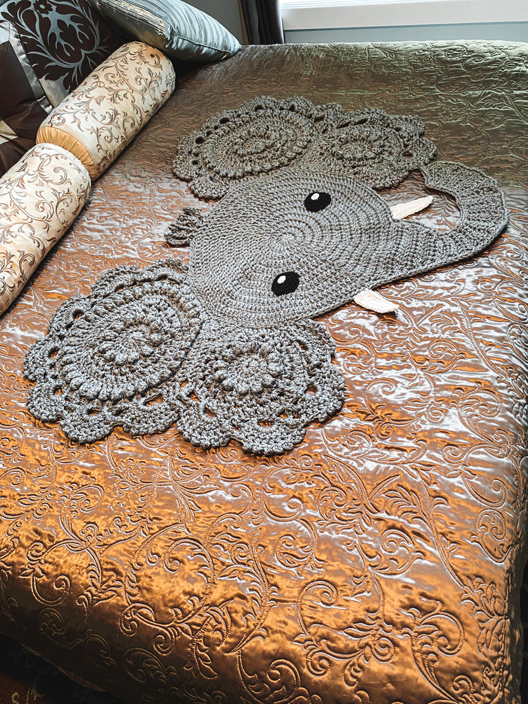 Edgar the Elephant is big and bold, a 100% acrylic rug triple-stranded for superior strength. He's huge enough to take a tour across a king-sized bed (just check out the pics)! Get ready for some serious safari style - this elephant's sure to hold up! Front view shown on bed.