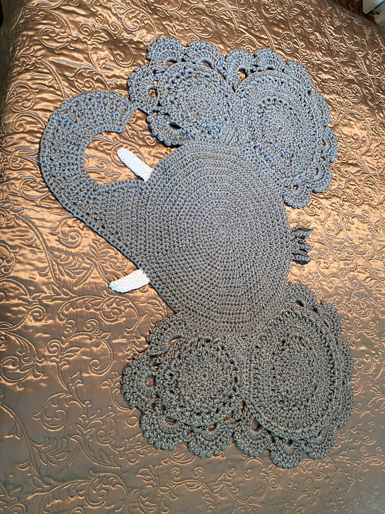 Edgar the Elephant is big and bold, a 100% acrylic rug triple-stranded for superior strength. He's huge enough to take a tour across a king-sized bed (just check out the pics)! Get ready for some serious safari style - this elephant's sure to hold up! Back view shown.