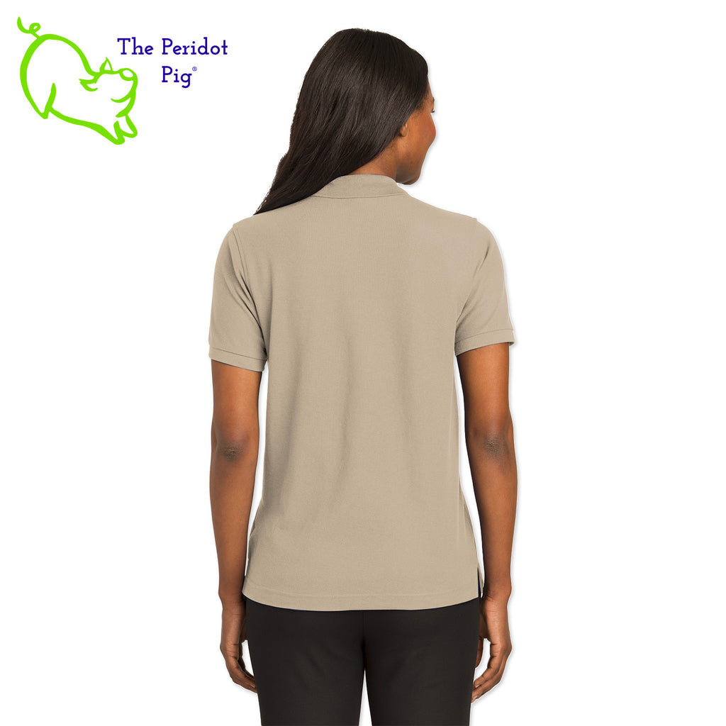 Renowned for its resilience, our incomparably comfortable classic polo is second to none. Expertly designed to resist wrinkles and shrinkage, this must-have polo delivers a luxuriously soft feel. Featuring the iconic EAA Chapter 5 logo on the left chest, you won't ever regret choosing this timeless piece. Back view shown in Stone.