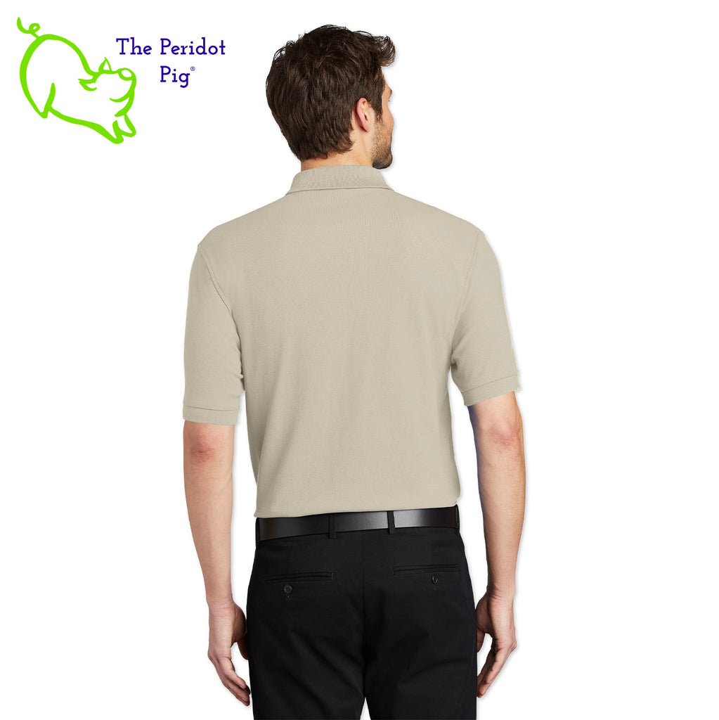 Renowned for its resilience, our incomparably comfortable classic polo is second to none. Expertly designed to resist wrinkles and shrinkage, this must-have polo delivers a luxuriously soft feel. Featuring the iconic EAA Chapter 5 logo on the left chest, you won't ever regret choosing this timeless piece. Back view shown in Stone.