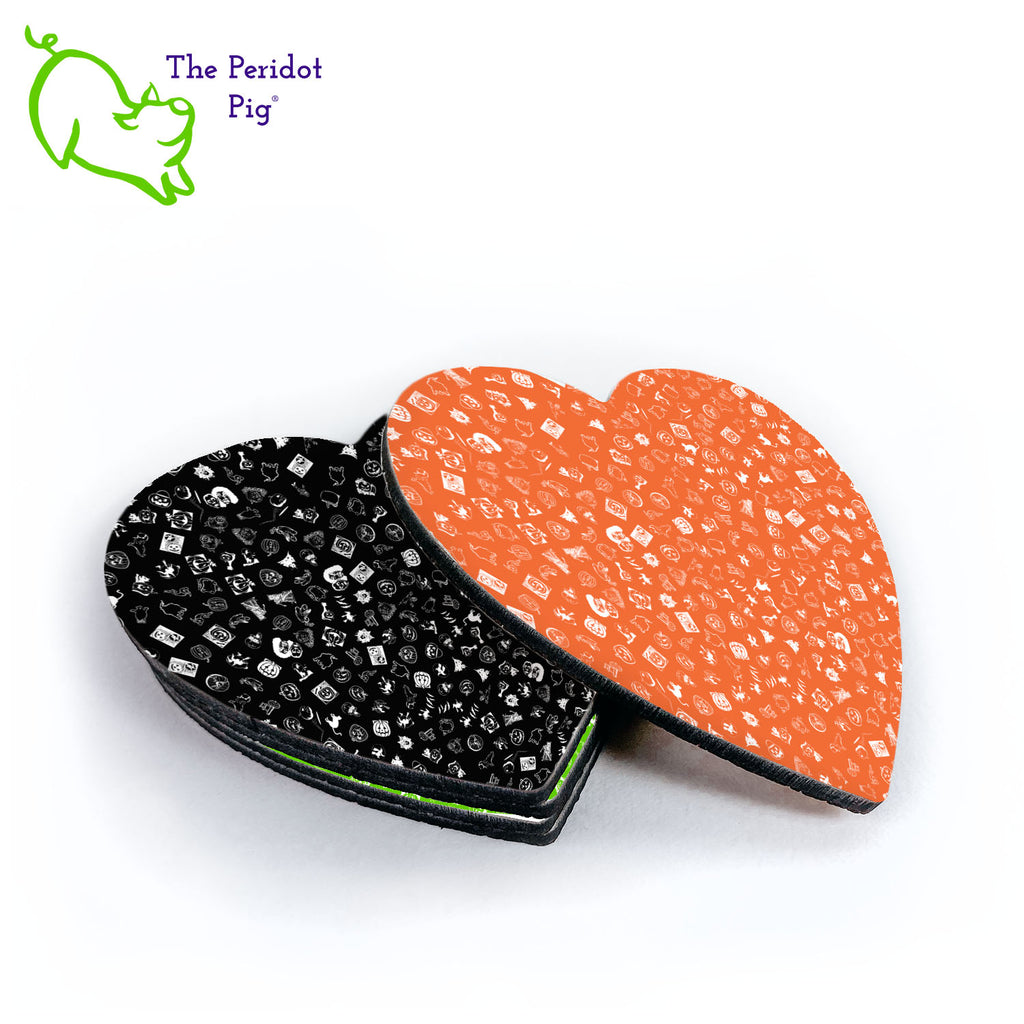 These are Halloween-themed coasters but you have to look close. They come in a set of four; black, green, purple and orange. Each has tiny little images of Halloween that include cats, witches, ghosts and jack-o-lanterns. Shown in a stack.