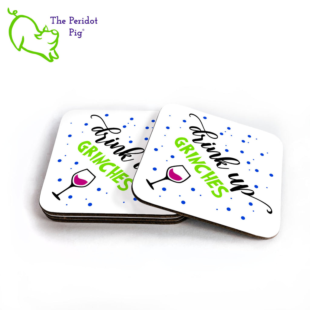 How about a little Grinch touch for your holiday entertaining? This set of four coasters is printed in bright colors on either a matte or a gloss coaster. They say, "Drink up Grinches" with a little glass of red wine pictured. The coasters are printed in a durable ink that won't fade over time. Perfect for both hot and cold beverages. Available in gloss or matte finish. Shown in a stack of four.