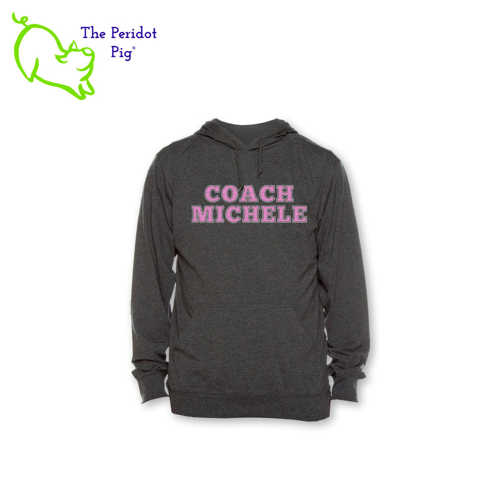 The Coach Michele long sleeve t-shirt hoodie is a light-weight version of your classic pullover hoodie. The front features the text, "Coach Michele" in two colors of glitter vinyl. The back is blank. Front view shown in Charcoal.