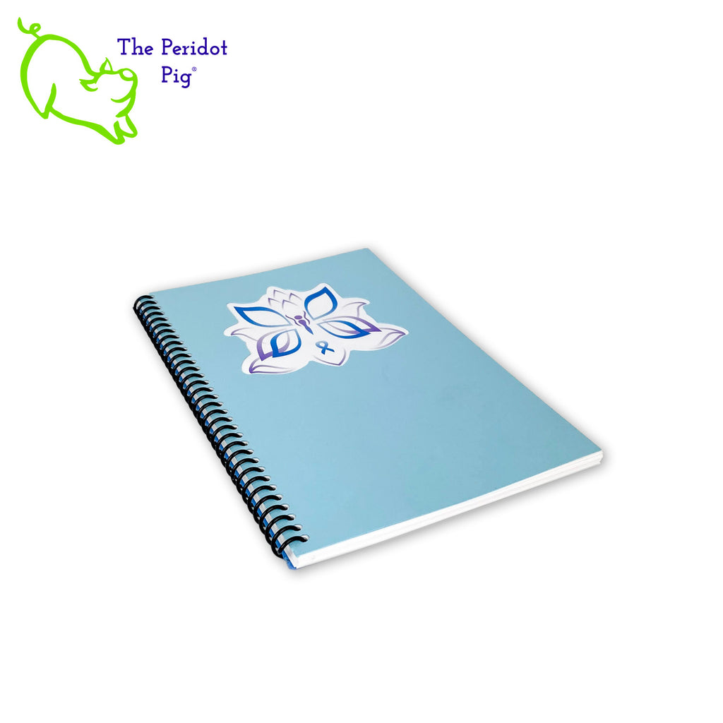 The journal is printed on 32 bond 5.5 x 8" paper which is a joy to write in. Colorful pages and illustrations help lay out your monthly, weekly and daily plans. The front cover is a beautiful light blue with a cutout around her logo. The back is a darker blue cover stock. All of the 94 pages are bound in a spiral coil allowing the journal to lie flat or fold back.  Your personalization will be added to the top of the second page for free. Front view.