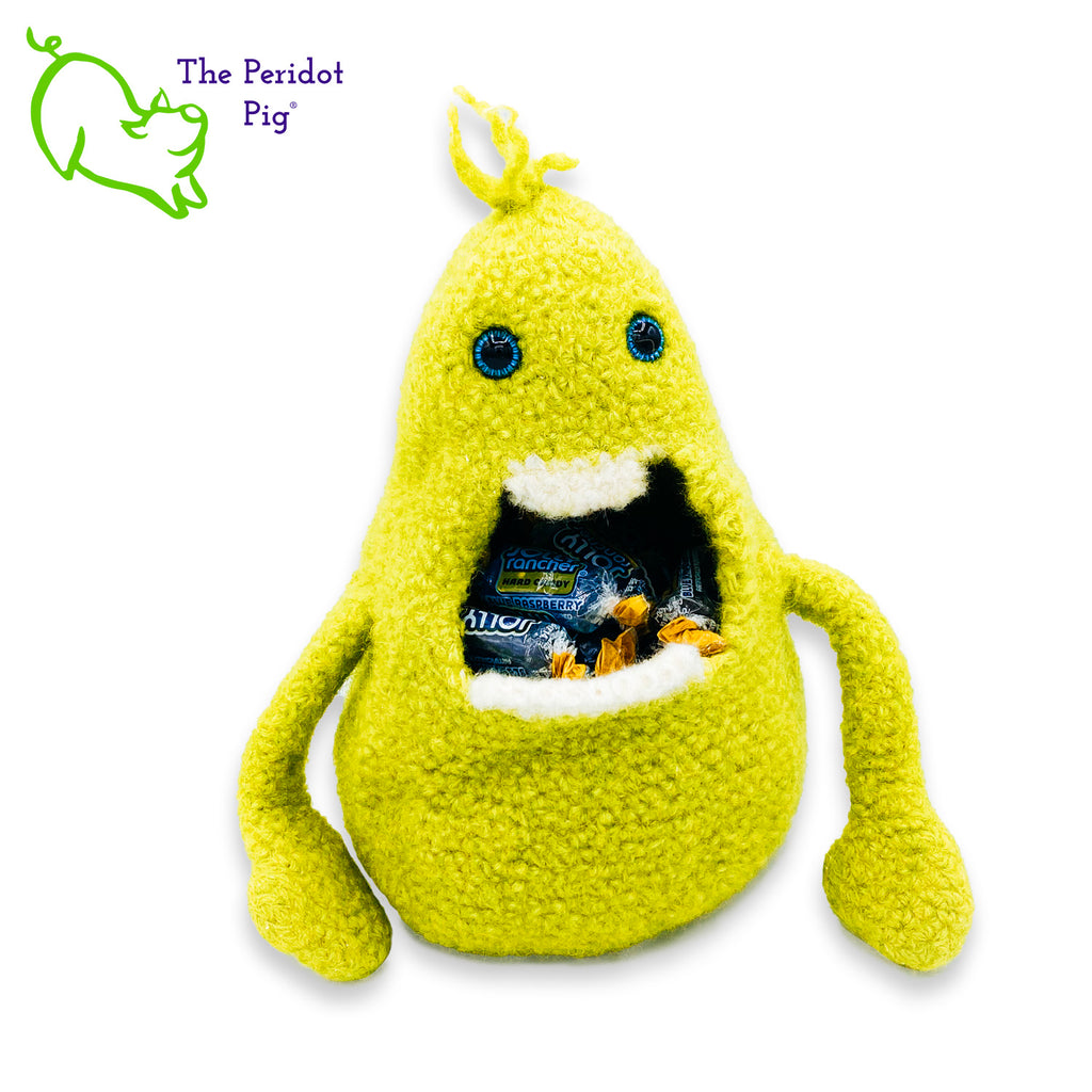 Gary has a big mouth! He's not loud though...he just likes to cram stuff in his big mouth. He prefers candy but you could easily fill him with anything.  His dream is to show up in a kid's Easter basket one day. Definitely needs to be a special kid that appreciates little monsters like Gary. He's made of 100% wool that has been felted down to create his hollow body. His arms are floppy and he has a little tuft of his pear green hair on top.  His eyes are a bright blue. Front view shown with candy.