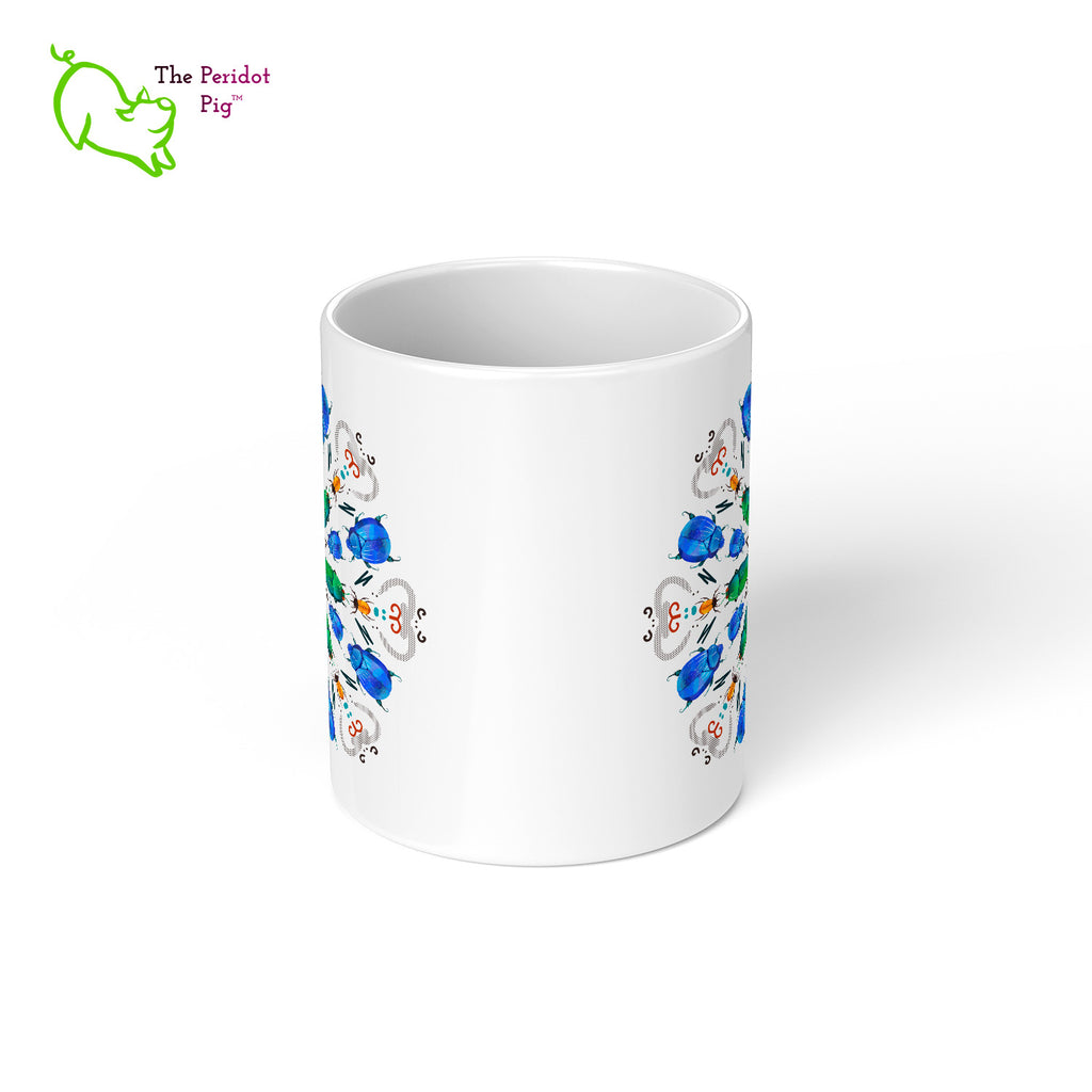 A colorful mandala of beetles graces this 11 oz mug. The center beetles have shades of bright green.  The smaller beetles are blue and orange. Printed on a glossy white mug, these bugs really pop! Center view