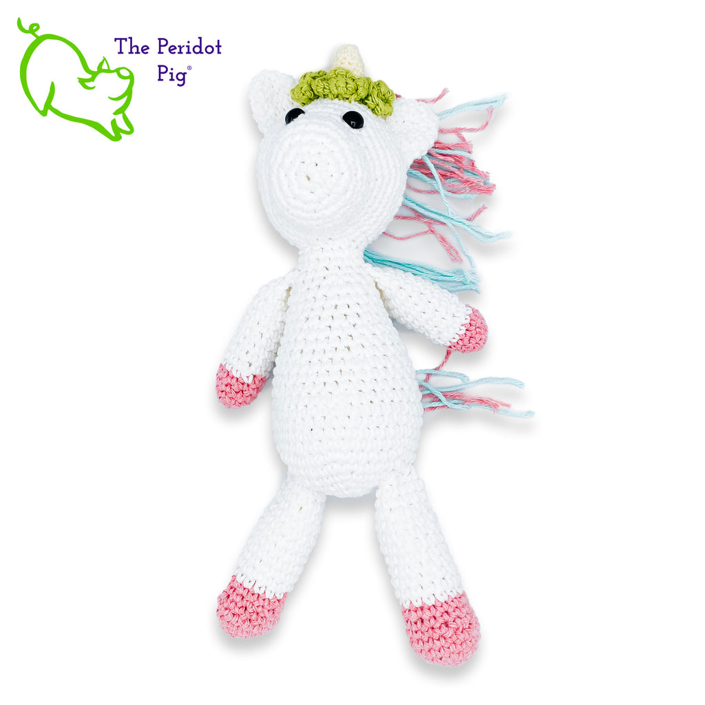 Lily is my first unicorn amigurumi. She's made of sturdy cotton yarn in white, pink, teal and green. She has a cute little yellow horn with three green flowers surrounding her head. She's a soft, squishy toy but still pretty indestructible and meant to last a life-time.  Front view long shown.