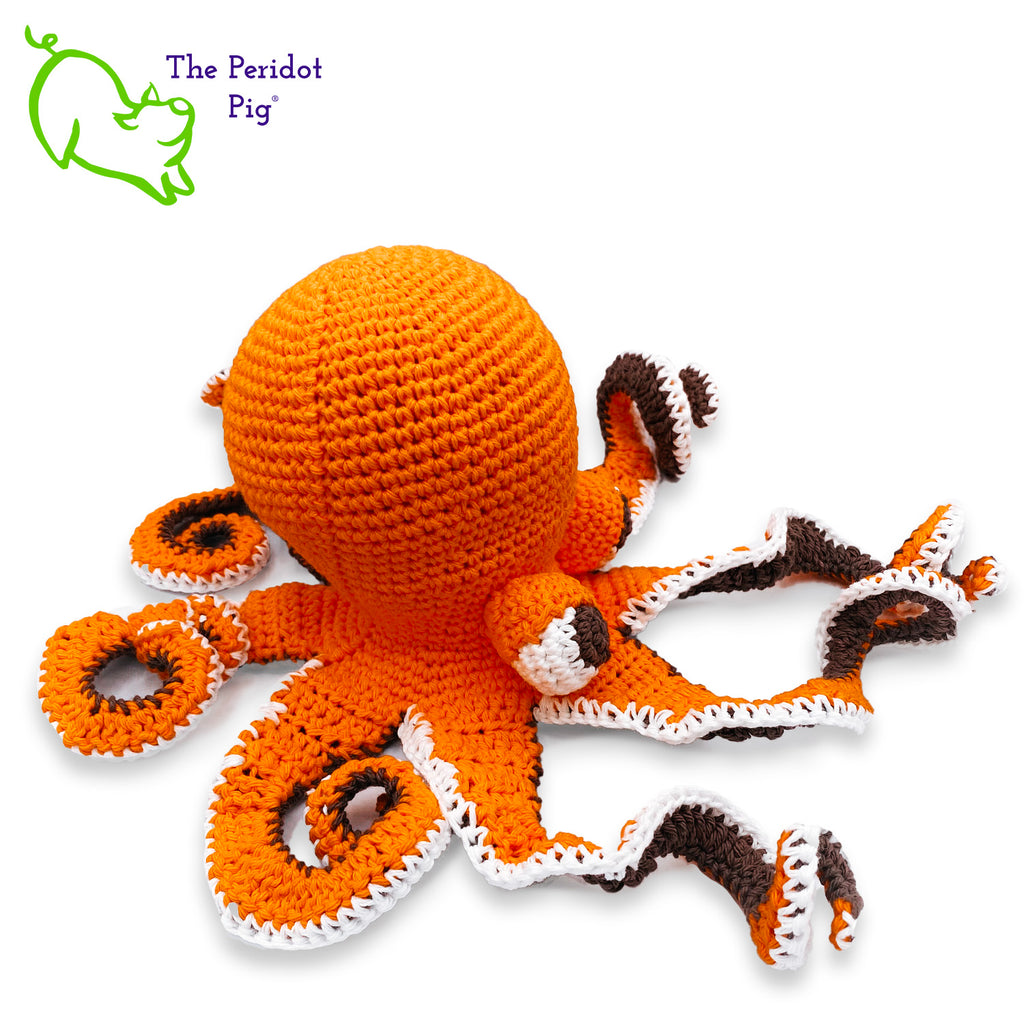 My husband thought an octopus only comes in black but we begged to differ! The North Pacific Giant Octopus come is a lovely shade of orange like our Olivia. At first glance, she's a bit intimidating but in reality, she is soft and cuddly. Olivia is made from sturdy cotton and is meant to last a life-time. Right view shown.