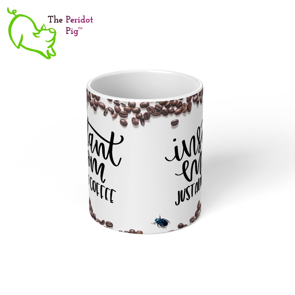 When we were designing these mugs, it felt like something was missing.  It really needed a little, blue beetle.  So we snuck one in...we're sure Mom will appreciate it. In addition, there are a lot of coffee beans on this gloss white mug with the fun saying, "Instant Mom Just Add Coffee". Shown in 11oz size, center view.