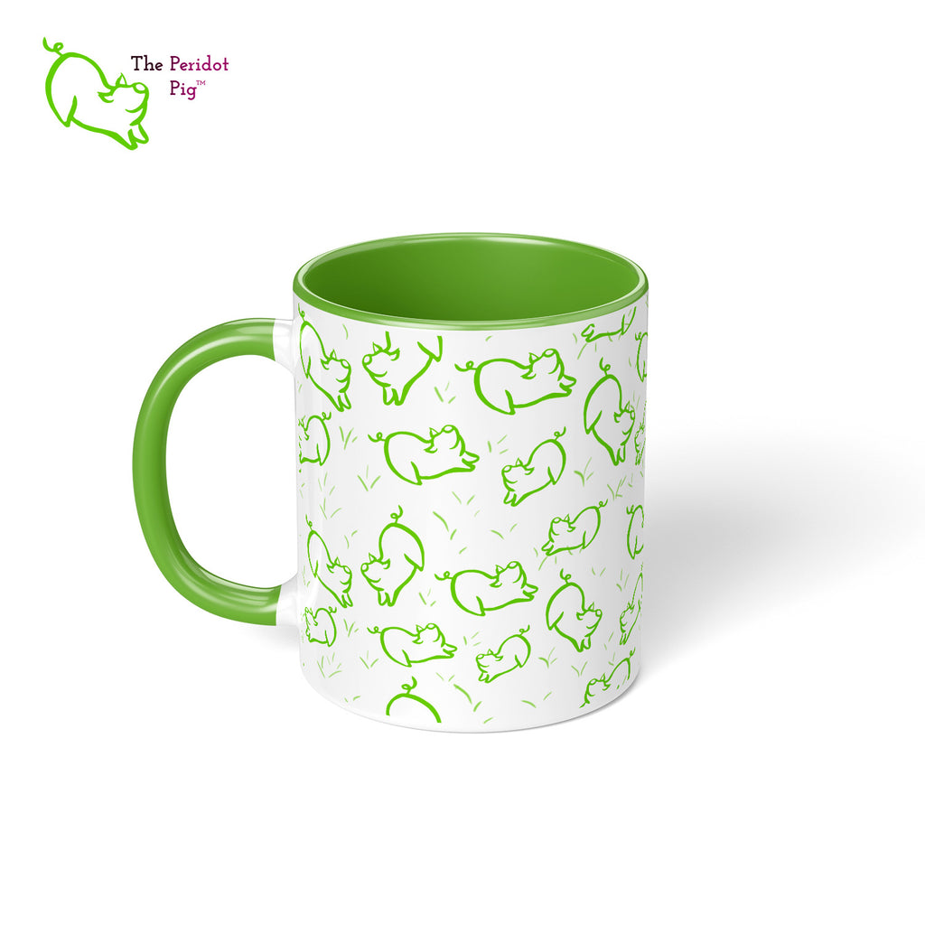 Peri's perky little peridot self is frolicking across this mug. Frolicking so much that you have to call it dancing a pig jig. This bright green mug is sure to brighten the start of your day. Left view