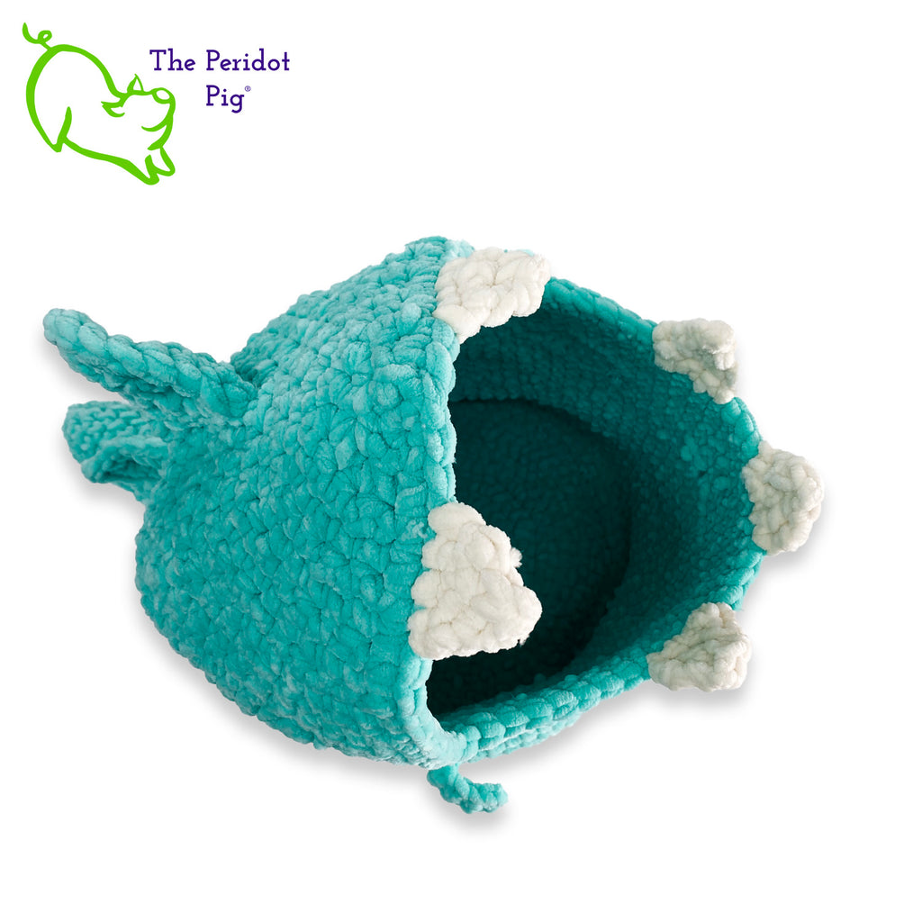 Hear Tiffany roar! Luckily she looks more menacing than reality. She's soft and plush from being made with a soft poly chenille. She just wants a hug but she has these little tiny arms which make it hard. Even her teeth and spikes are soft! As you can see, Tiffany has a big mouth that can hold a lot of toys, towels, clean diapers, even toilet paper (we put in 9 double rolls!). Top view shown.