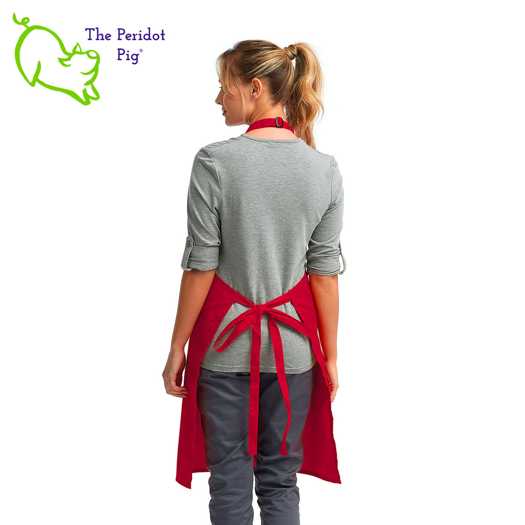 Looking for a special gift for the baker in your life? Here's a fun Christmas treat for them! The front says, "Christmas is what you bake of it" in bright festive colors. There are sparkly silver stars and a cute ginger bread man.  Back view shown in red.