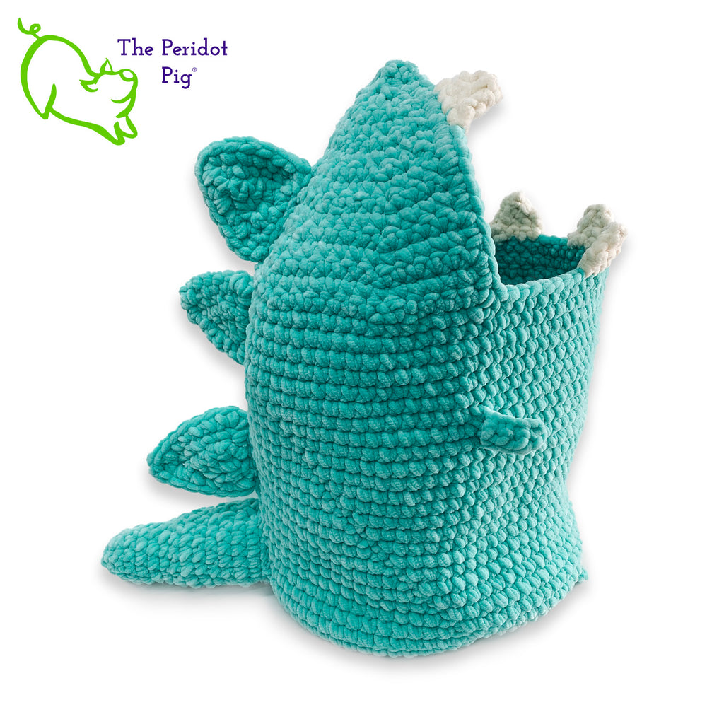 Hear Tiffany roar! Luckily she looks more menacing than reality. She's soft and plush from being made with a soft poly chenille. She just wants a hug but she has these little tiny arms which make it hard. Even her teeth and spikes are soft! As you can see, Tiffany has a big mouth that can hold a lot of toys, towels, clean diapers, even toilet paper (we put in 9 double rolls!). Right view shown.