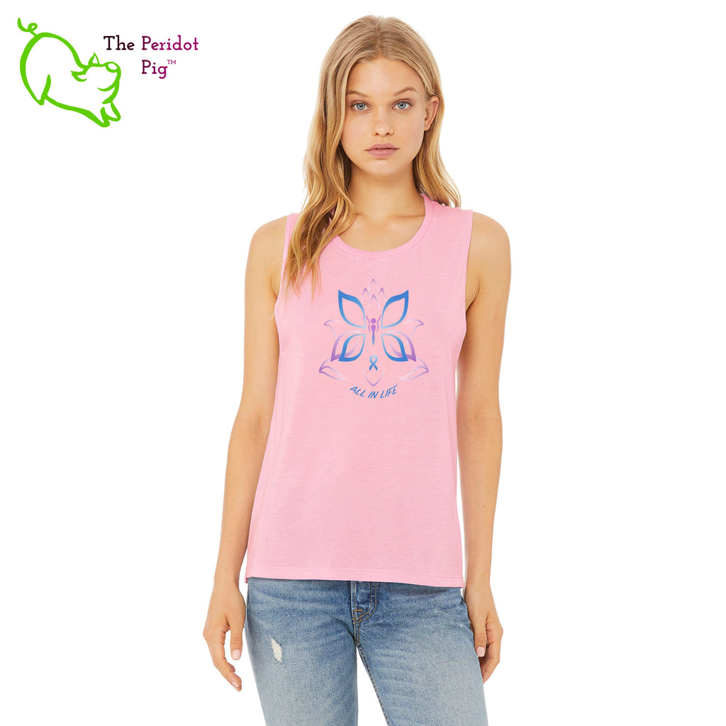 This comfortable muscle tank is soft and flowy with low cut armholes for a relaxed look. The shirt features Kristin Zako's logo on the front in bright blue and purple colors. The back is blank. The print is a translucent, faded "vintage" look due to the blend of the fabric. Front view in Lilac.