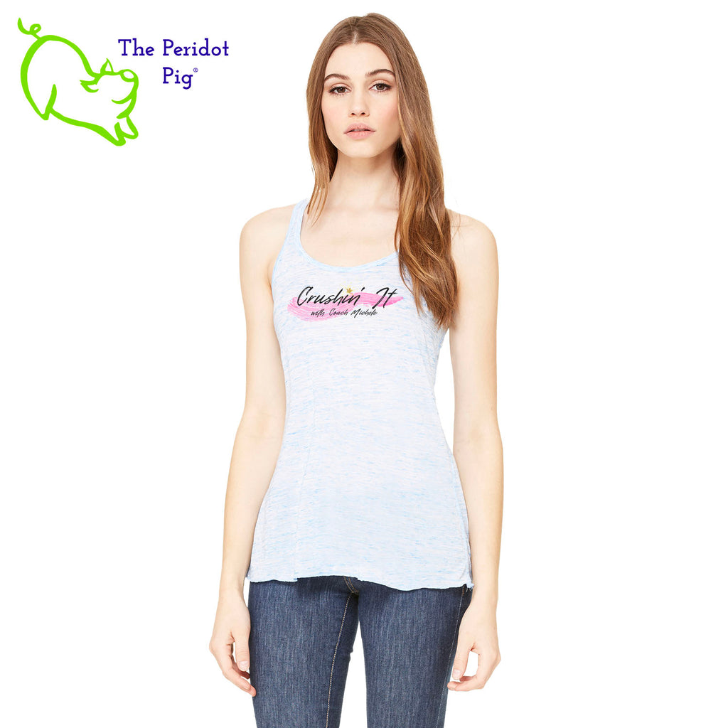 The front features Coach Michele Smits' Crushin' It! logo and the back is blank. There's also a small gold, glitter star over the "i" because everyone needs a little sparkle! The print will be in a "vintage" look that is slightly faded on the white, pink and athletic heather versions. On the marble colors, the print is a little more vivid. Front view in Blue Marble.