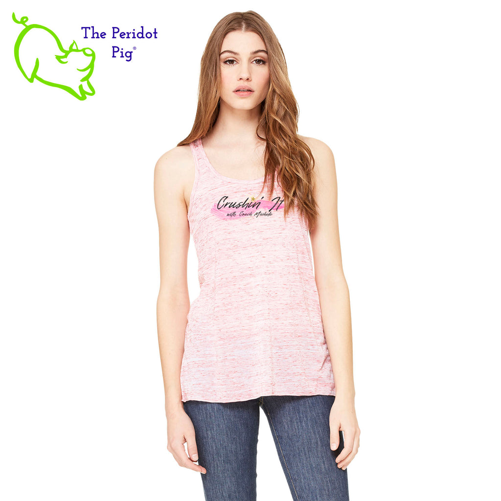 The front features Coach Michele Smits' Crushin' It! logo and the back is blank. There's also a small gold, glitter star over the "i" because everyone needs a little sparkle! The print will be in a "vintage" look that is slightly faded on the white, pink and athletic heather versions. On the marble colors, the print is a little more vivid. Front view in Red Marble.