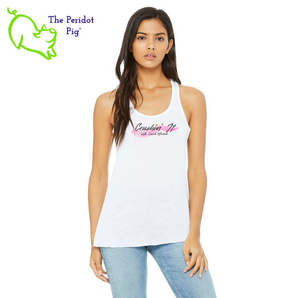 The front features Coach Michele Smits' Crushin' It! logo and the back is blank. There's also a small gold, glitter star over the "i" because everyone needs a little sparkle! The print will be in a "vintage" look that is slightly faded on the white, pink and athletic heather versions. On the marble colors, the print is a little more vivid. Front view in White.