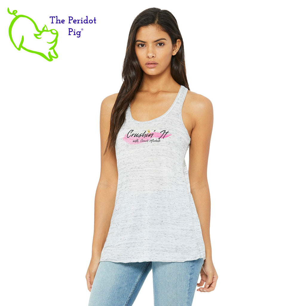 The front features Coach Michele Smits' Crushin' It! logo and the back is blank. There's also a small gold, glitter star over the "i" because everyone needs a little sparkle! The print will be in a "vintage" look that is slightly faded on the white, pink and athletic heather versions. On the marble colors, the print is a little more vivid. Front view in White Marble.