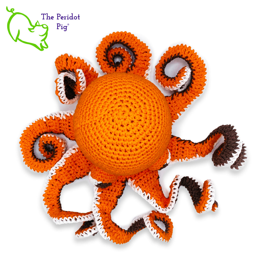 My husband thought an octopus only comes in black but we begged to differ! The North Pacific Giant Octopus come is a lovely shade of orange like our Olivia. At first glance, she's a bit intimidating but in reality, she is soft and cuddly. Olivia is made from sturdy cotton and is meant to last a life-time. Top view shown.