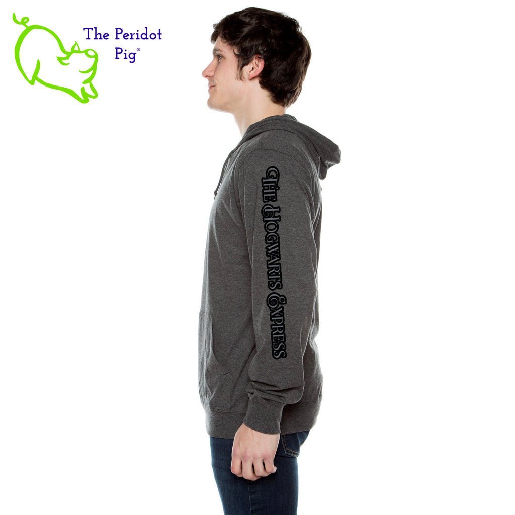 We created this shirt for that Harry Potter Fan Girl/Boy that might be looking for something a bit more subtle. We use a long sleeve t-shirt hoodie is a light-weight version of your classic pullover hoodie. The front features a small version of the 9 3/4 platform number on the pocket. The back is blank and the left sleeve has "The Hogwarts Express" in a tone on tone flowing font. Side view.