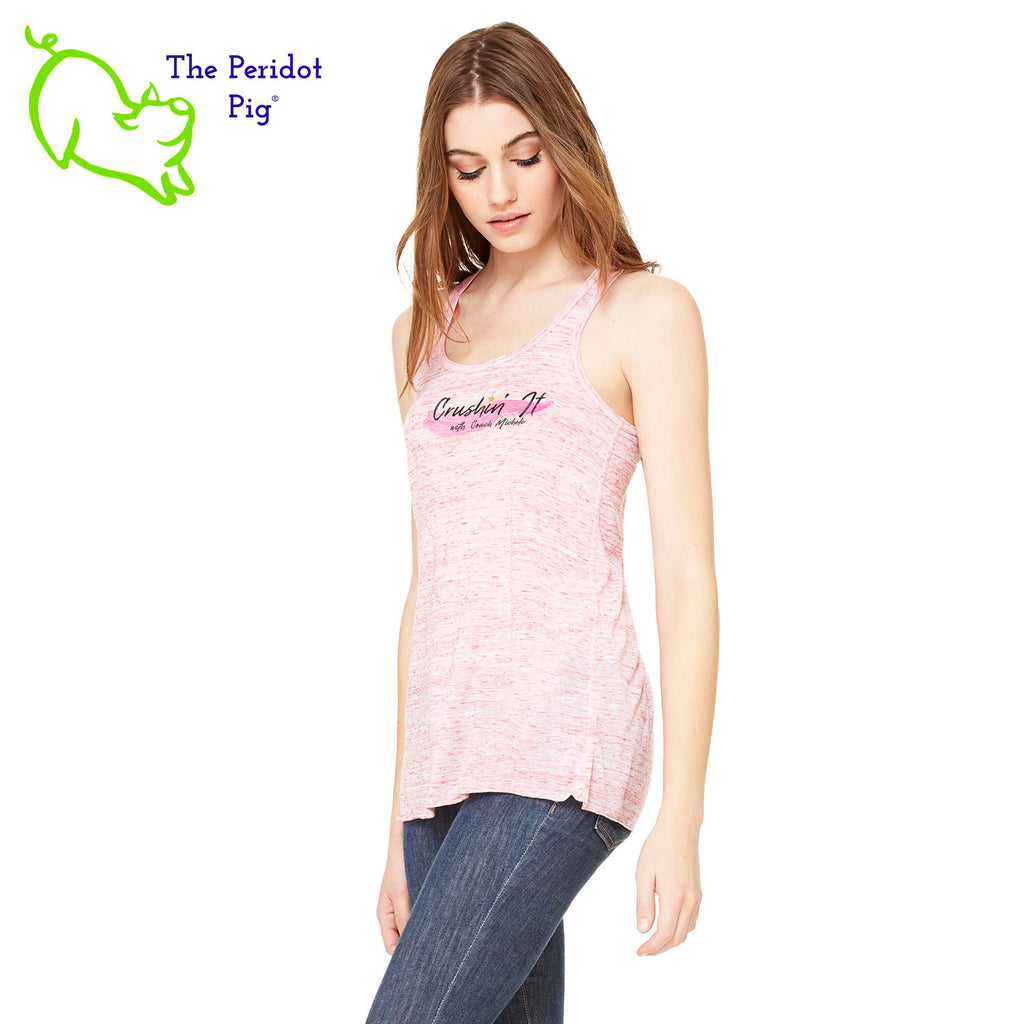 The front features Coach Michele Smits' Crushin' It! logo and the back is blank. There's also a small gold, glitter star over the "i" because everyone needs a little sparkle! The print will be in a "vintage" look that is slightly faded on the white, pink and athletic heather versions. On the marble colors, the print is a little more vivid. Side view in Red Marble.