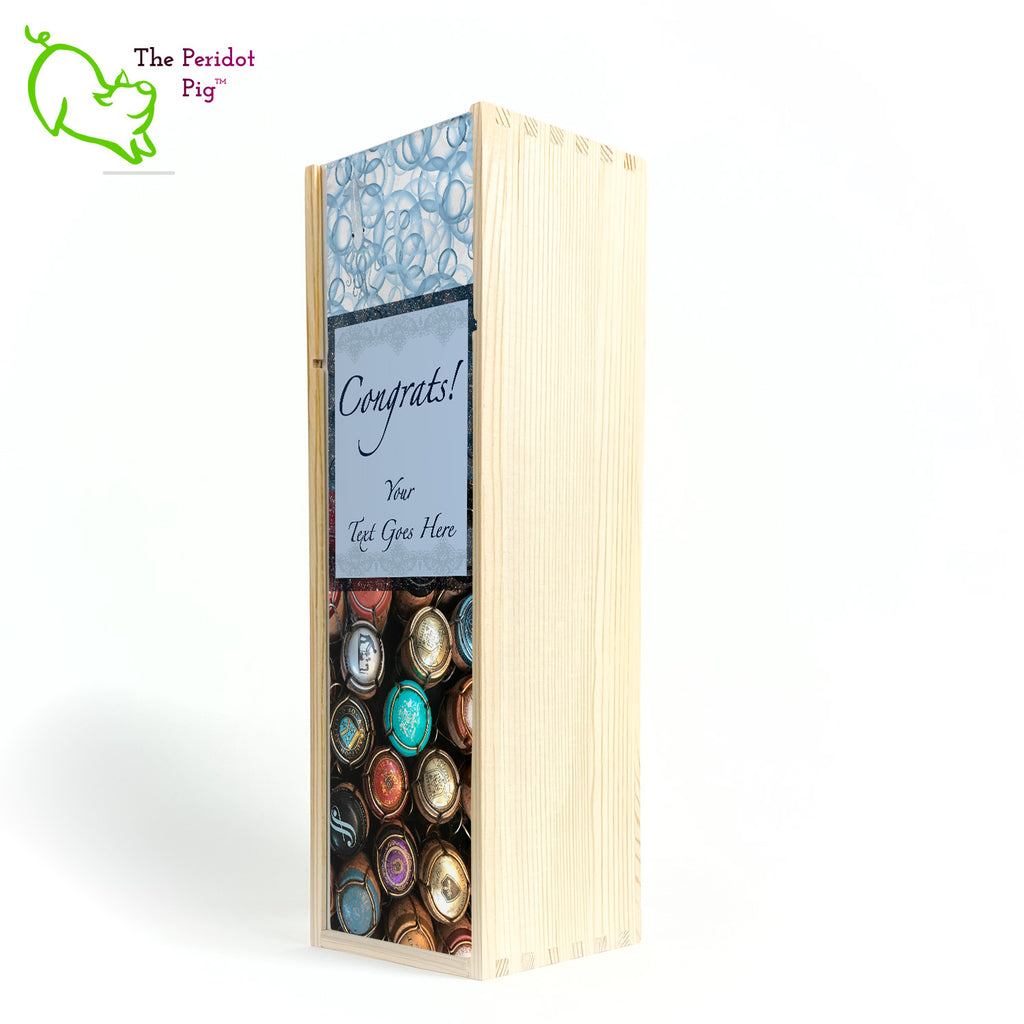 The wine box front panel is decorated in a glossy, detailed print with a space for a customized name(s) and/or a date. This model has a colorful picture of champagne corks on the bottom. The center frame features a field of blue with antique lace and flowing script.  We warned you that we were hiding another little squid and you'll see him peaking from the bubbles at the top of the panel! Congrats, front closed view in Natural.