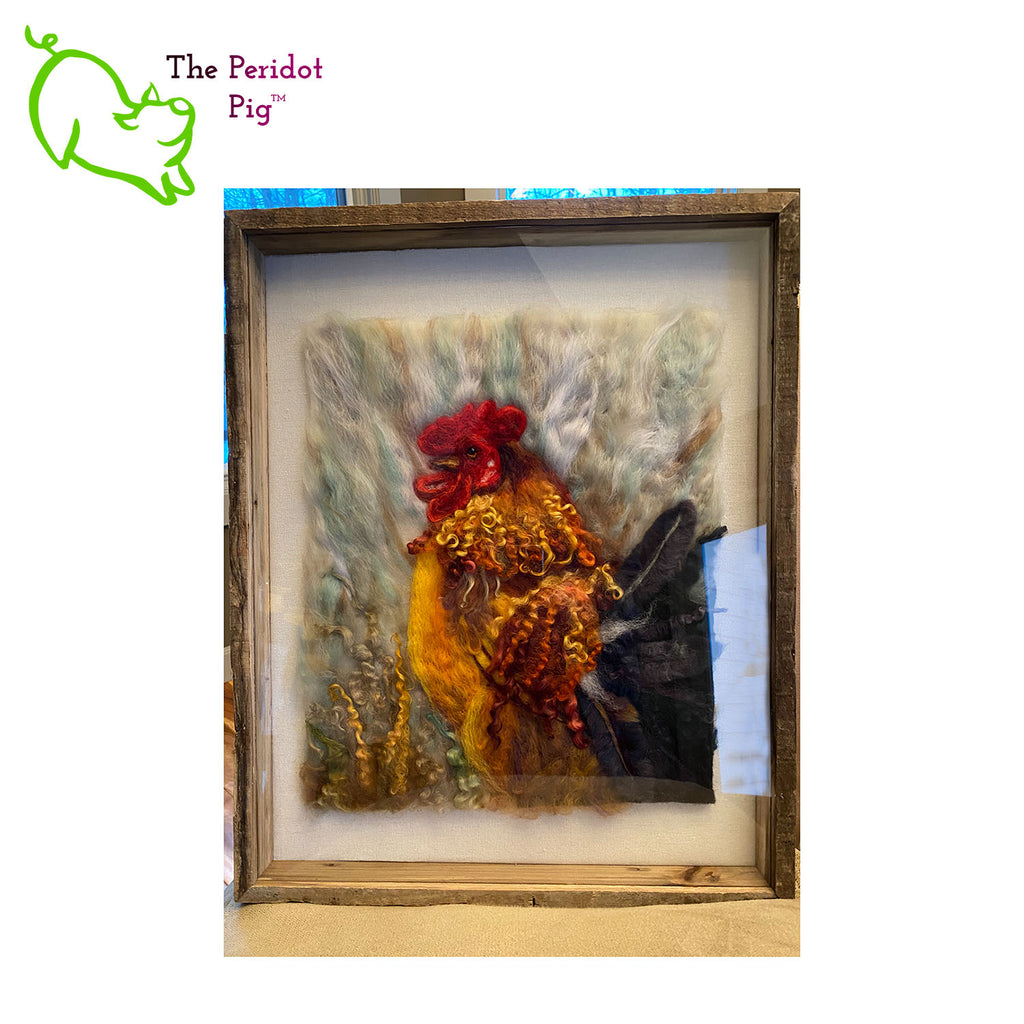 This needle felt 2D "painting" depicts a rooster in full color glory. It's crafted from 100% wool, even the feathers! Each one is unique and may vary a little in color and texture.  The art is needle felted onto a wool backing and measures 12 x 14 x .75".  Shown in a 16" x 20" shadow box frame..