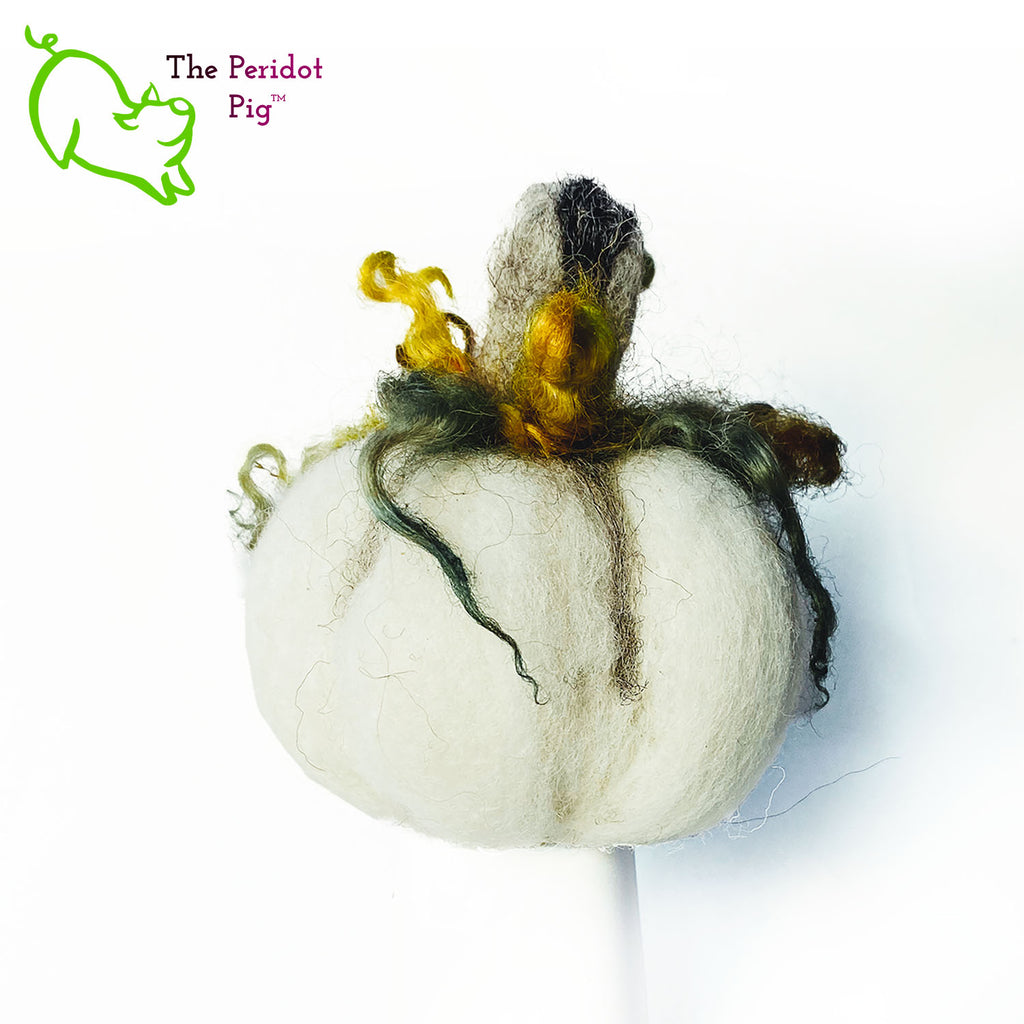 Just in time for the Halloween season, we're offering these one-of-a-kind pumpkins. We call them PolterPumpkins due to their ghostly, grotesque inspired faces. Each one is unique and hand-made from needle felted 100% wool. The pumpkin measures about 4-5" wide and around 4-5" tall. The body is crafted in white wool with the face in a stony gray. Multi-color locks simulate a little vine growth at the top. Back view - Fred.