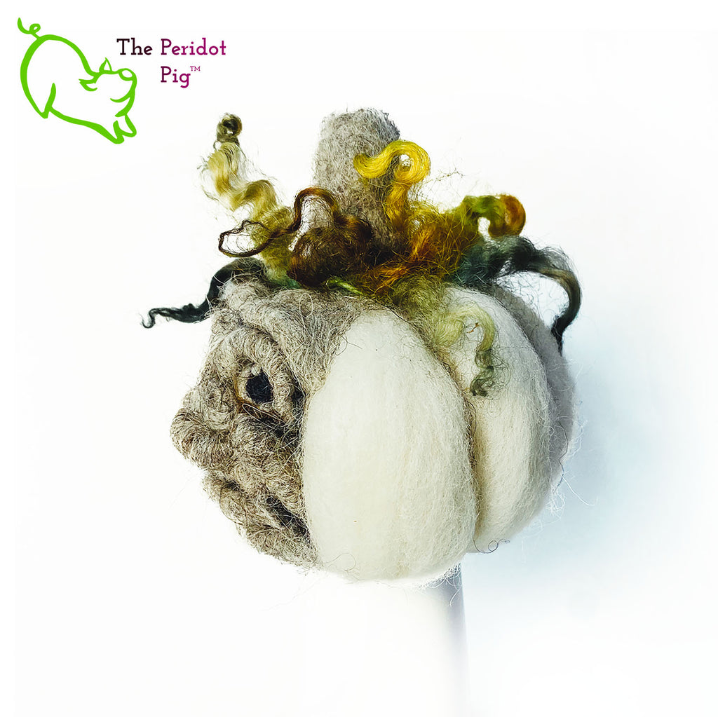 Just in time for the Halloween season, we're offering these one-of-a-kind pumpkins. We call them PolterPumpkins due to their ghostly, grotesque inspired faces. Each one is unique and hand-made from needle felted 100% wool. The pumpkin measures about 4-5" wide and around 4-5" tall. The body is crafted in white wool with the face in a stony gray. Multi-color locks simulate a little vine growth at the top. Left view - Fred.