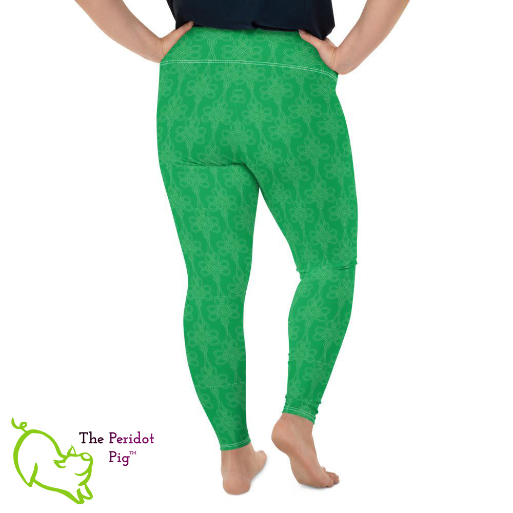 Avoid the pinching on St Patrick's Day with a pair of bright green leggings! These leggings feature a shamrock Celtic-style knot pattern set on a bright kelly green background. Back view.