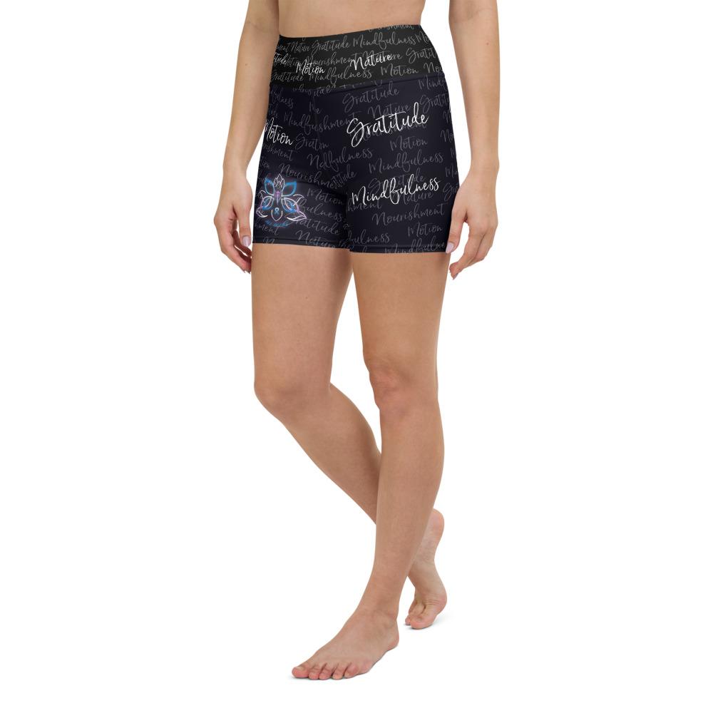 These yoga shorts have a body-flattering fit that will make you feel super comfortable even during the most intense workouts. They come with a high waistband and are made from soft microfiber yarn. The Kristin Zako print is filled with her four pillars phrases and topped off with her logo on the front right leg. Shown in black. Left view.