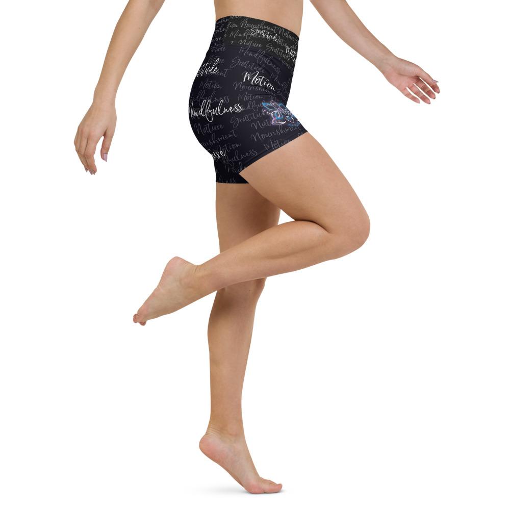 These yoga shorts have a body-flattering fit that will make you feel super comfortable even during the most intense workouts. They come with a high waistband and are made from soft microfiber yarn. The Kristin Zako print is filled with her four pillars phrases and topped off with her logo on the front right leg. Shown in black. Right view.