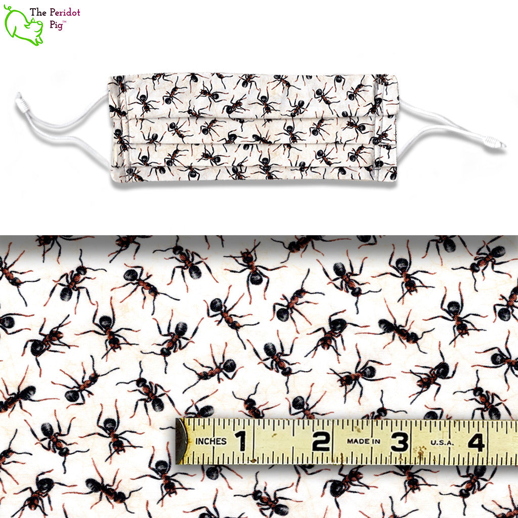 A fabric pattern covered in ants on a yellow/white background. Called Ants. View shows the mask cnd the scale of the fabric.