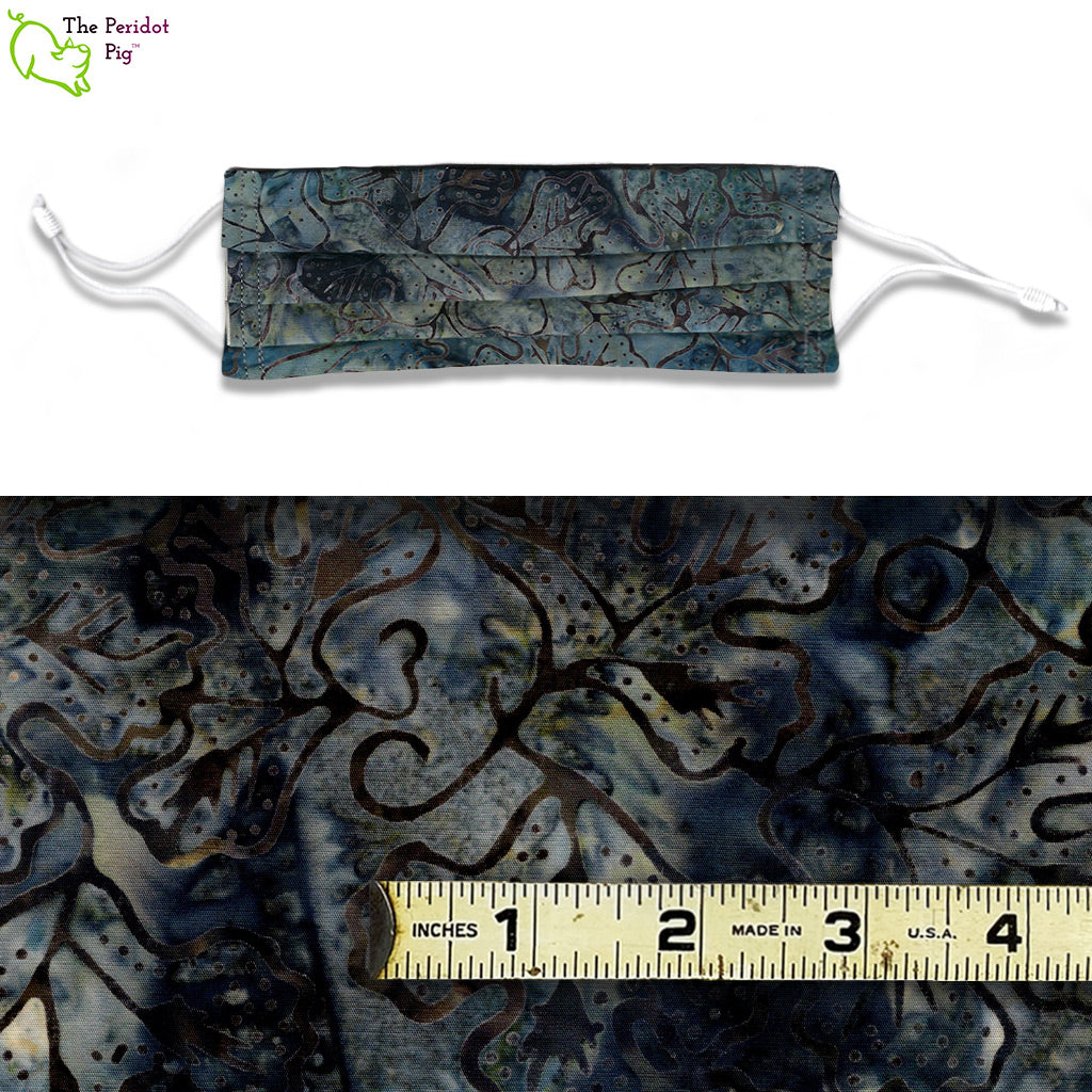 The Blue Batik fabric is a dark grey, blue with scrolling vines.  There's a sheen of golden brown running through the pattern. The cloth has a luscious feel to it!