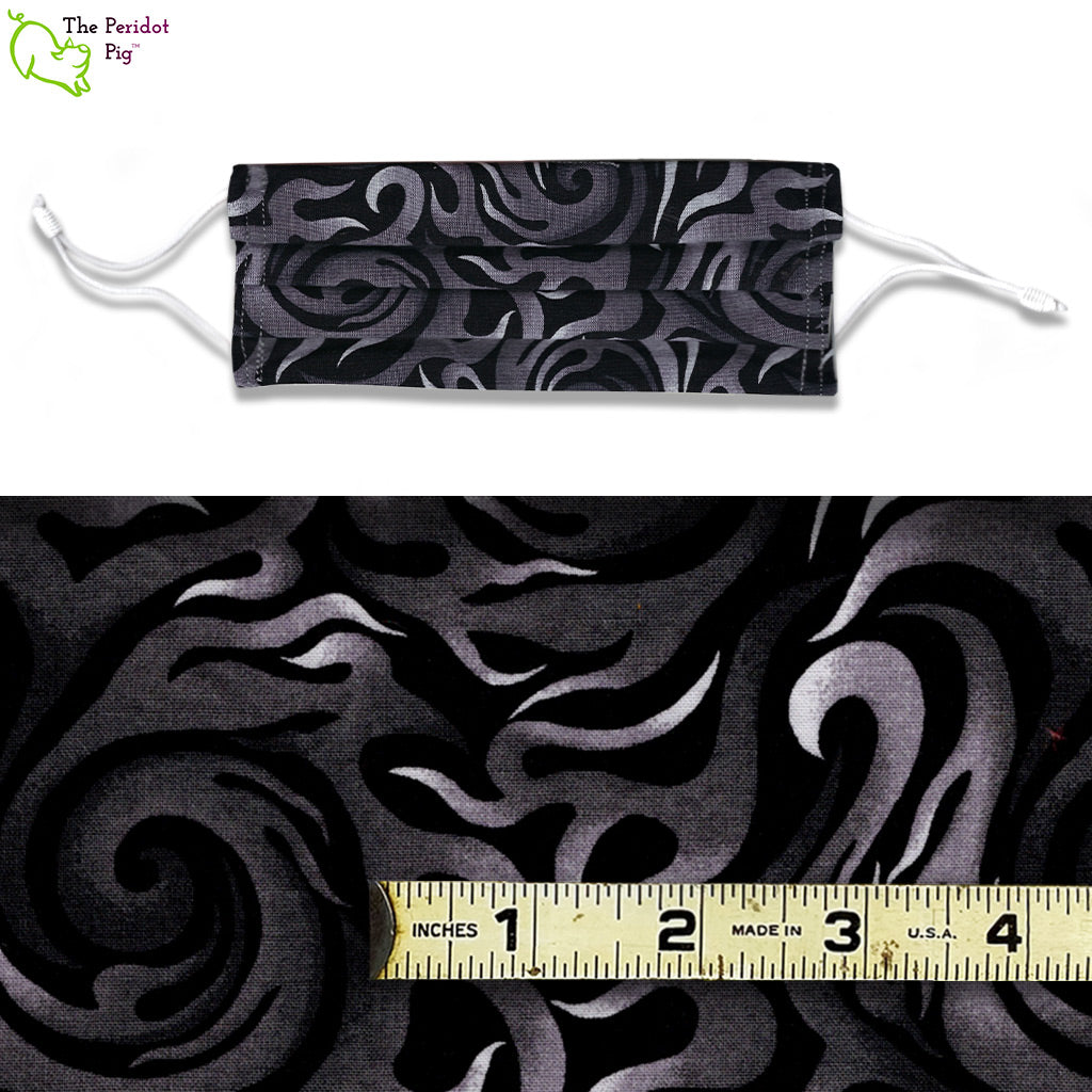 A view showing the mask and the scale of the pattern. A mixed color fabric with grey and white smoke/flames on a black background. Called Grey Smoke