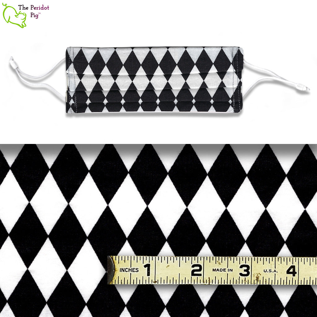 A view showing the mask and the scale of the pattern. A mixed color fabric with black and white diamonds. Called Harlequin.