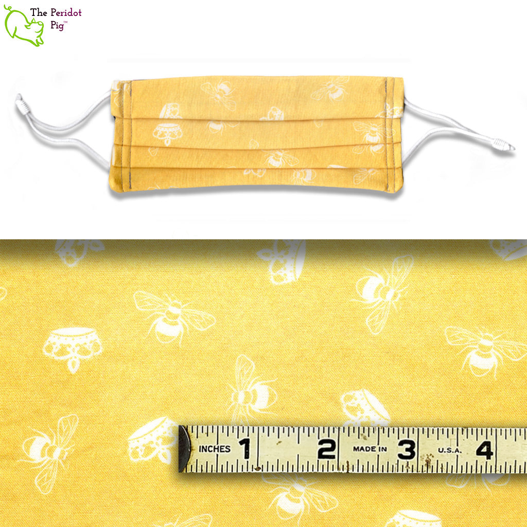 White bees and crowns on a yellow fabric background. Called Queen Bee.